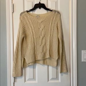 A cream sweater